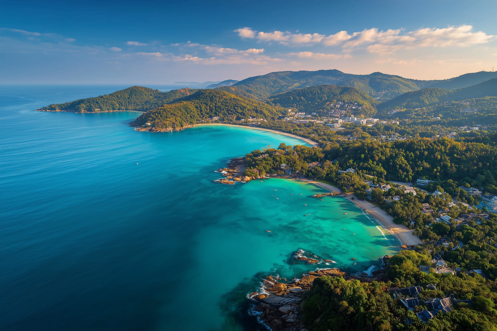 Kata Beach in Phuket with calm sand, blue water, and a family-friendly resort area